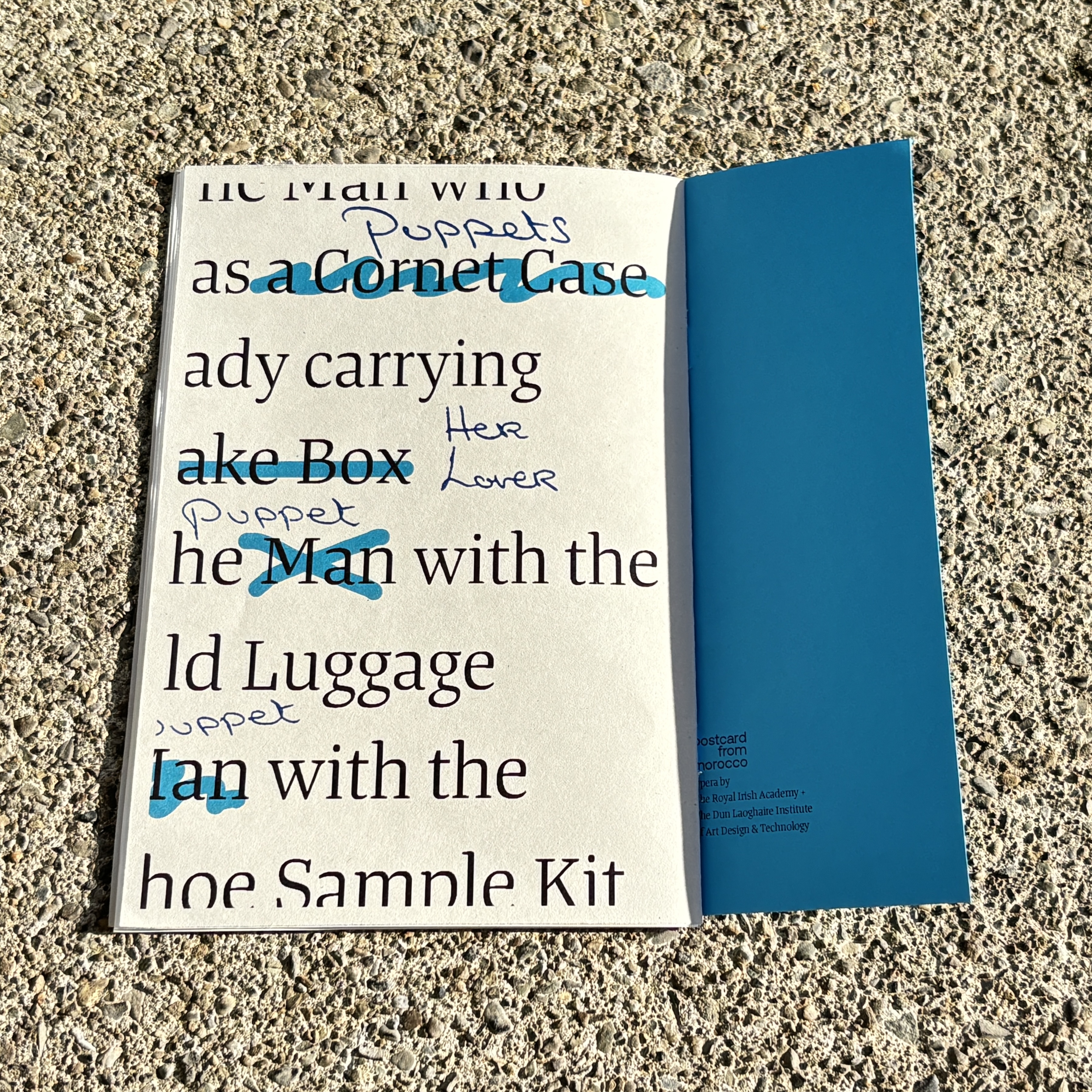 Programme spread showing typographic list of characters and their possessions, with handwritten annotations layered on top